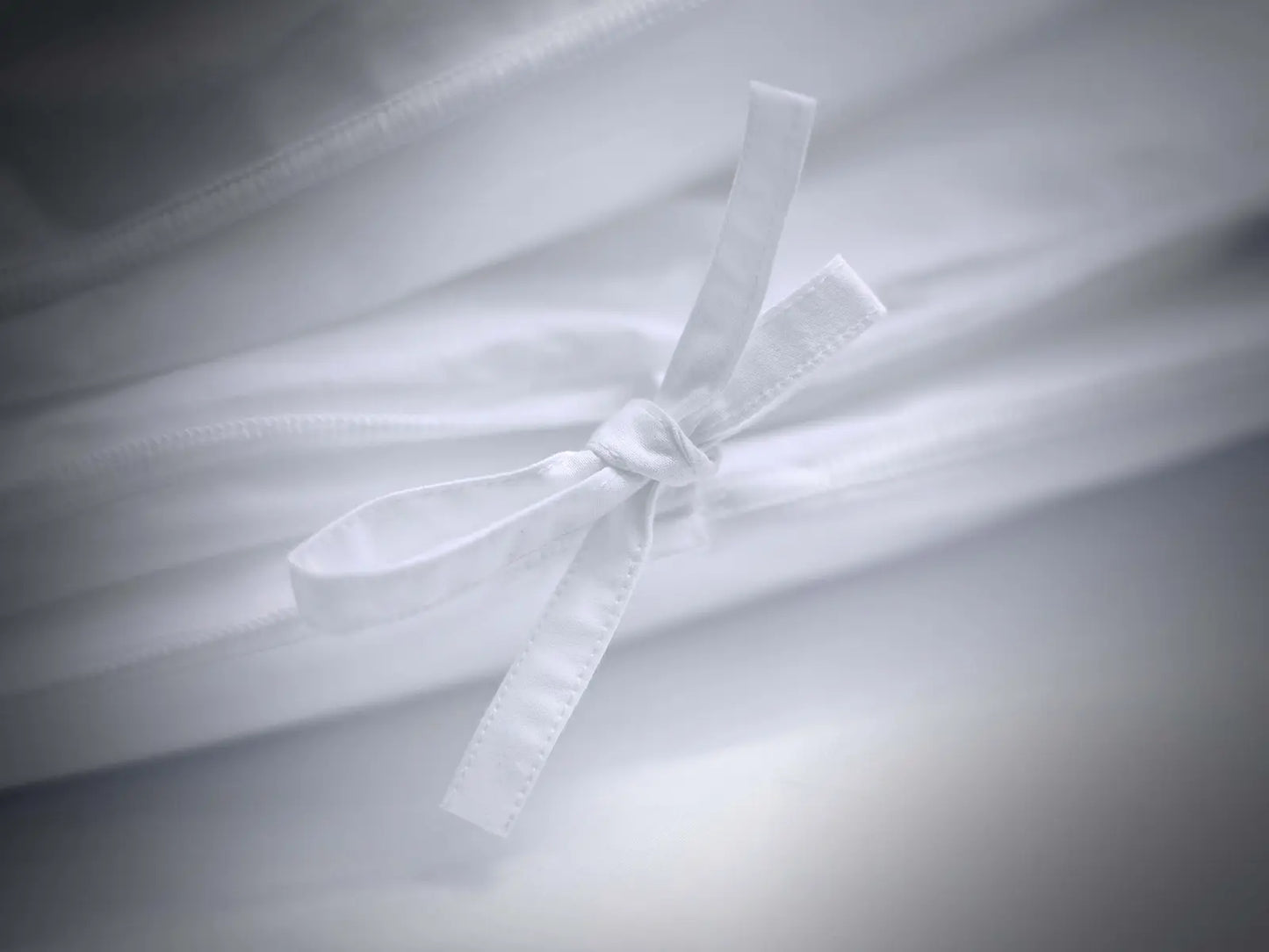 Détail couette 4 saisons synthétique